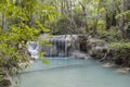 Jangle landscape with flowing turquoise water of Erawan cascade waterfall Royalty Free Stock Photo