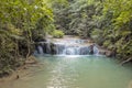 Jangle landscape with flowing turquoise water of Erawan cascade waterfall Royalty Free Stock Photo