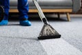 Janitor Cleaning Carpet With Vacuum Cleaner Royalty Free Stock Photo