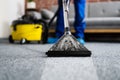 Janitor Cleaning Carpet With Vacuum Cleaner Royalty Free Stock Photo