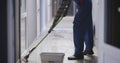 Janitor cleaning a corridor Royalty Free Stock Photo