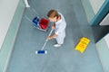 Janitor Cleaning Floor Of Corridor Pass Royalty Free Stock Photo