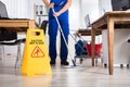 Janitor Cleaning Floor In Office Royalty Free Stock Photo