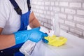 Janitor Cleaning Furniture With Cloth Royalty Free Stock Photo