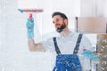 Janitor Cleaning Window With Squeegee Royalty Free Stock Photo