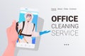 Janitor in hazmat suit cleaner in mask smartphone screen self isolation office cleaning service concept Royalty Free Stock Photo