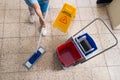 Janitor Mopping Floor With Cleaning Equipments Royalty Free Stock Photo