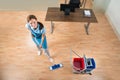 Janitor Mopping Floor In Office Royalty Free Stock Photo