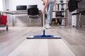 Janitor Cleaning Floor With Mop Royalty Free Stock Photo