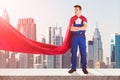 Janitor In Superhero Costume Standing On Top Of Building Royalty Free Stock Photo