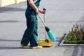 Janitor sweeping broom street Royalty Free Stock Photo