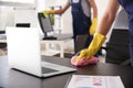 Janitor wiping table in office Royalty Free Stock Photo