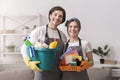 Janitorial Services. Portrait Of Professional Cleaners With Household Supplies In Hands Royalty Free Stock Photo