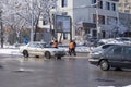 Janitors are cleaning snow on street after snowstorm. Manual work.