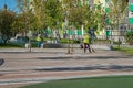 Janitors sweeping the recreational area of multistorey residential complex