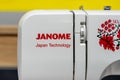 Janome brand logo on a sewing machine. Minsk, Belarus - march 29, 2023 Royalty Free Stock Photo