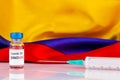 Janssen covid vaccine vial and Colombian flag. Vaccination concept..BOGOTA, COLOMBIA - FEBRUARY Royalty Free Stock Photo