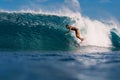 January 4, 2023. Bali, Indonesia. Surfer ride on surfboard in barrel wave