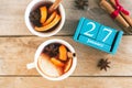 January 27. Blue cube calendar with month and date and cups with mulled wine