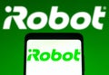 January 31, 2022, Brazil. In this photo illustration the iRobot Corporation logo seen displayed on a smartphone and on the Royalty Free Stock Photo