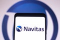 January 25, 2022, Brazil. In this photo illustration, a Navitas Semiconductor logo is seen displayed on a smartphone screen and in