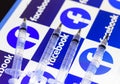 January 27, 2021, Brazil.In this photo illustration various medical syringes seen with Facebook logo displayed on a screen in the