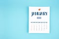 January 2025 calendar page with push pin on blue background Royalty Free Stock Photo