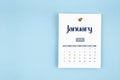 January 2026 calendar page with push pin on blue background Royalty Free Stock Photo