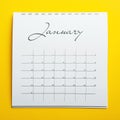 January calendar on yellow background, top view