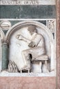 January, detail of the bass-relief representing the Labor of the months of the year, Cathedral in Lucca, Italy