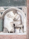January, detail of the bass-relief representing the Labor of the months of the year, Cathedral in Lucca, Italy