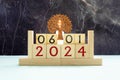 January 6 displayed wooden letter blocks on white background with space for print. Concept for calendar, reminder, date.