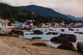 January 19, 2022. Florianopolis, Brazil. Colorful houses in Ribeirao da Ilha village and sea coastline at sunset Royalty Free Stock Photo