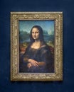 Mona Lisa portrait by the Italian artist Leonardo da Vinci isolated on blue background, Paris, France 2024