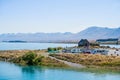 JANUARY 7, 2018 LAKE TEKAPO, NEW ZEALAND - Scene of Mt Cook and Church of the Good Shepherd with crowd of tourist and car I