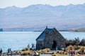 JANUARY 7, 2018 LAKE TEKAPO, NEW ZEALAND - Scene of Mt Cook and Church of the Good Shepherd with crowd of tourist and car I