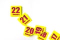 January 22nd. Day 22 of month, Calendar date. Many yellow sheet of the calendar. Winter month, day of the year concept