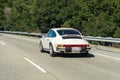 January 20, 2018 Redwood City / CA / USA - Classic Porsche model 1975 Porsche 911 Carrera 2.7 MFI Coupe cruising on the highway