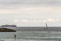 Big ship, sailing boat and stand up paddle surfer in Copacabana, Rio de Janeiro, Brazil Royalty Free Stock Photo