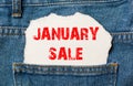 January sale on white paper in the pocket of blue denim jeans