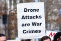 January 4, 2020 San Jose / CA / USA - Close up of Drone Attacks are War Crimes sign raised at the anti-war protest in front of the