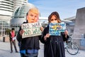 January 4, 2020 San Jose / CA / USA - Protesters wearing Donald Trump and Melania Trump masks and holding anti-war sign at the