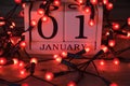 January 1st calendar with red fairy lights