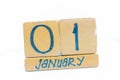 January 1st. Day 1 of month, calendar on wooden background. Winter time, New year concept Royalty Free Stock Photo