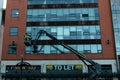 January 29th, 2018, Cork, Ireland - men doing high-rise window cleaning work in the Blackpool Retail Park