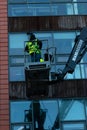 January 29th, 2018, Cork, Ireland - men doing high-rise window cleaning work in the Blackpool Retail Park