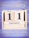 January 11th. Date of 11 January on wooden cube calendar