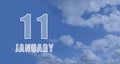 january 11. 11-th day of the month, calendar date.White numbers against a blue sky with clouds. Copy space, winter month Royalty Free Stock Photo