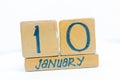 January 10th. Day 10 of month, calendar on wooden background. Winter time, year concept Royalty Free Stock Photo
