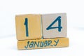 January 14th. Day 14 of month, calendar on wooden background. Winter time, year concept Royalty Free Stock Photo